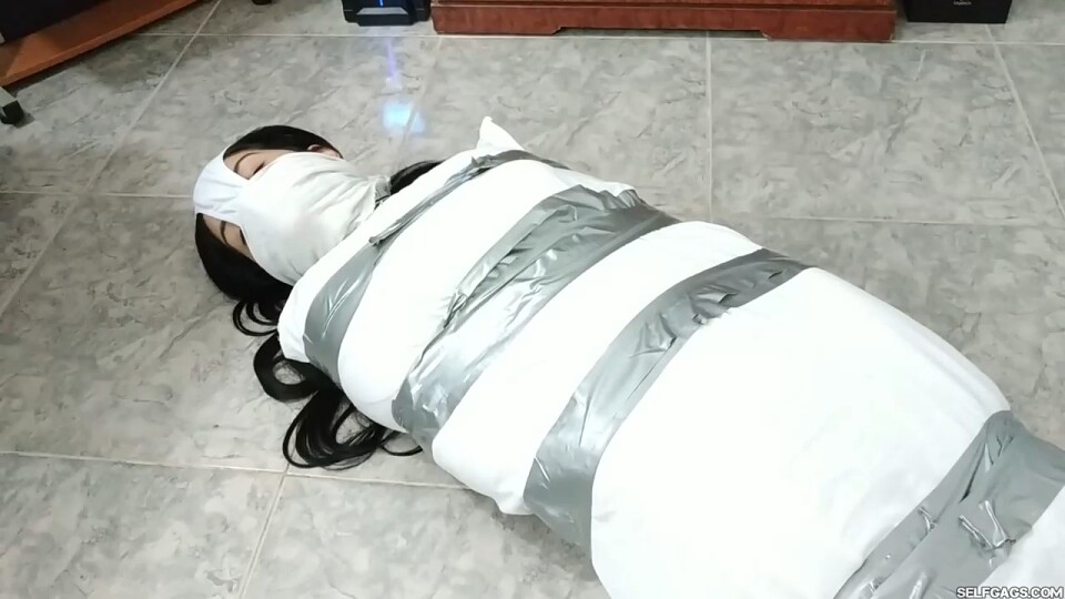 Girl Mummified, Panty Hooded, Gagged And Prepared