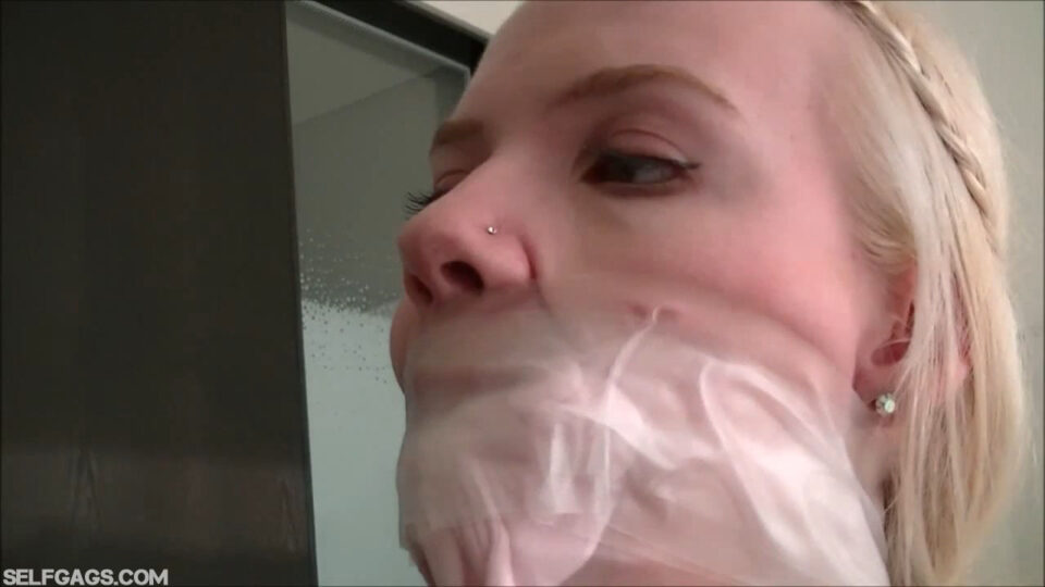Scandinavian Blonde: All Gagged Up with Inflatable Butterfly, Vet Wrap and a Cruel Double Sock Stuffing Wrapped in Her Mouth with Clear Medical Tape — gallery-5